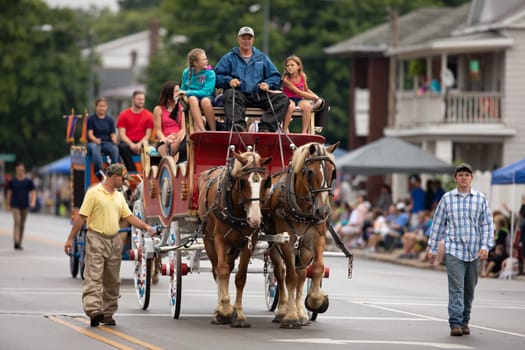 Peru, Indiana, USA - July 21, 2018 Two horses pulling a Circus wagon at the Circus City Festival Parade