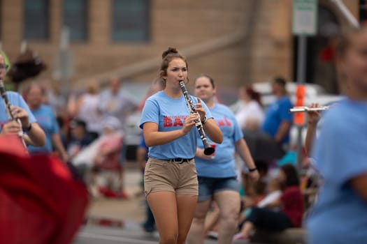 Peru, Indiana, USA - July 21, 2018 Members of the Maconaquah Marching Braves marching band perform at the Circus City Festival Parade