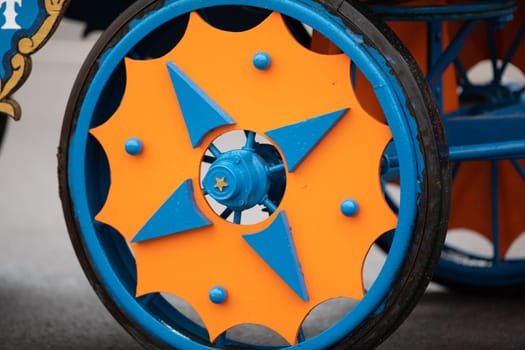 Peru, Indiana, USA - July 21, 2018 Close up of the colorful wheel of a circus wagon at the Circus City Festival Parade