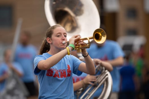Peru, Indiana, USA - July 21, 2018 Members of the Maconaquah Marching Braves marching band perform at the Circus City Festival Parade