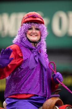 Peru, Indiana, USA - July 21, 2018 Woman dress up as a clown riding a horse at the Circus City Festival Parade