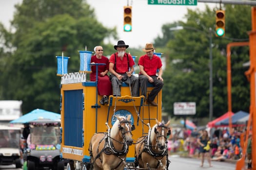 Peru, Indiana, USA - July 21, 2018 Two horses pulling a Circus wagon at the Circus City Festival Parade
