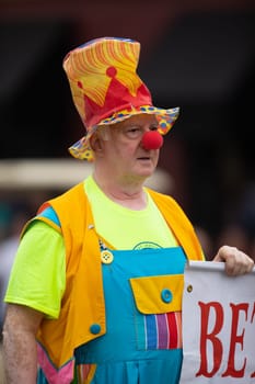 Peru, Indiana, USA - July 21, 2018 Man wearing a clown outfit at the Circus City Festival Parade