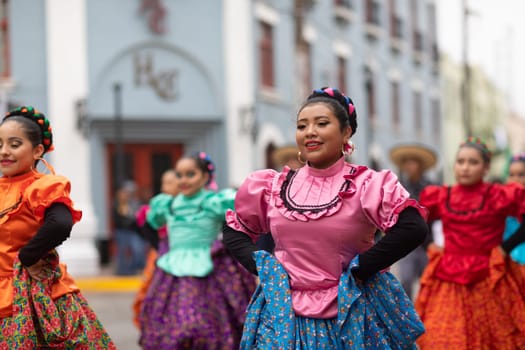 Matamoros, Tamaulipas, Mexico - November 20, 2018: The November 20 Parade, Young women wearing traditional Mexican clothing dancing