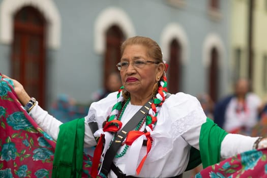Matamoros, Tamaulipas, Mexico - November 20, 2018: The November 20 Parade, Mexican Senior Woman wearing traditional mexican clothing dancing