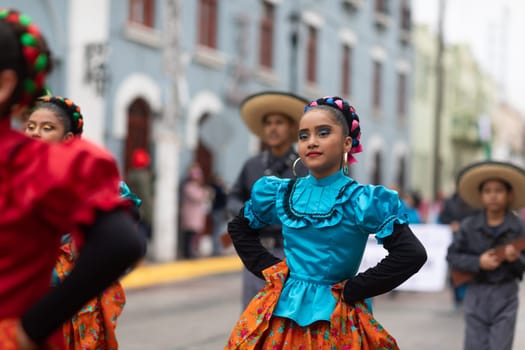 Matamoros, Tamaulipas, Mexico - November 20, 2018: The November 20 Parade, Young women wearing traditional Mexican clothing dancing