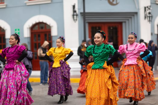 Matamoros, Tamaulipas, Mexico - November 20, 2018: The November 20 Parade, Young women wearing traditional Mexican clothing dancing
