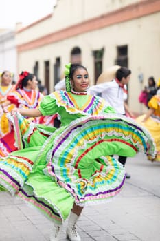 Matamoros, Tamaulipas, Mexico - November 20, 2018: The November 20 Parade, Young women and men dancing wearing traditional mexican clothing during the parade
