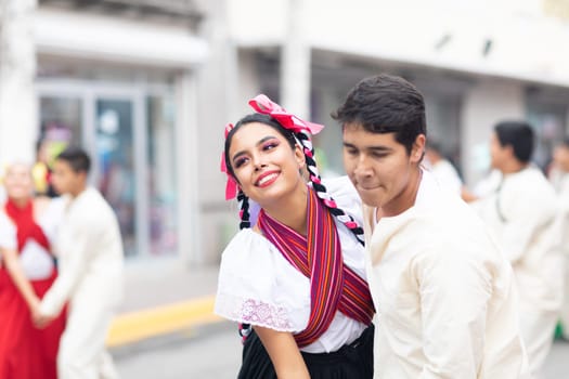 Matamoros, Tamaulipas, Mexico - November 20, 2018: The November 20 Parade, Young women and men dancing wearing traditional mexican clothing during the parade