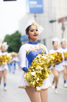 Matamoros, Tamaulipas, Mexico - November 20, 2018: The November 20 Parade, Mexican Cheerleaders dancing during the parade
