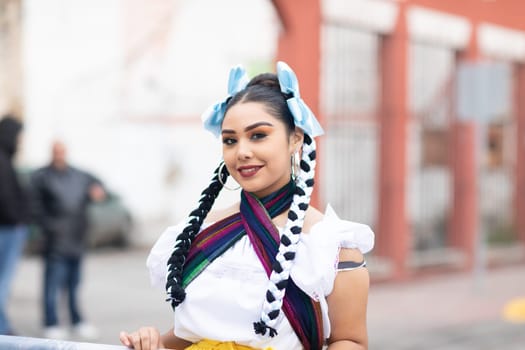 Matamoros, Tamaulipas, Mexico - November 20, 2018: The November 20 Parade, Young Mexican woman wearing traditional mexican clothing going down the road during the parade