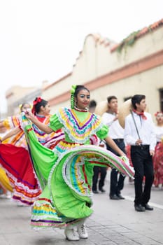 Matamoros, Tamaulipas, Mexico - November 20, 2018: The November 20 Parade, Young women and men dancing wearing traditional mexican clothing during the parade