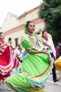 Matamoros, Tamaulipas, Mexico - November 20, 2018: The November 20 Parade, Young women and men dancing wearing traditional mexican clothing during the parade