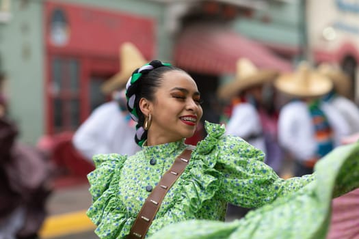 Matamoros, Tamaulipas, Mexico - November 20, 2018: The November 20 Parade, Young women and men dancing wearing traditional mexican clothing during the parade