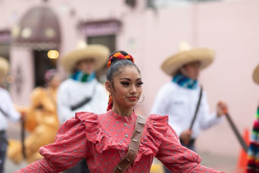 Matamoros, Tamaulipas, Mexico - November 20, 2018: The November 20 Parade, Young women and men dancing wearing traditional mexican clothing during the parade