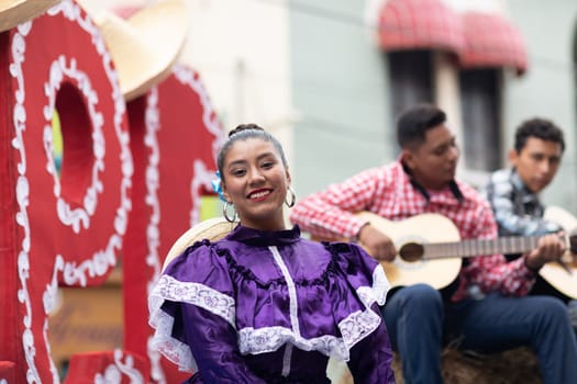 Matamoros, Tamaulipas, Mexico - November 20, 2018: The November 20 Parade, Young Mexican woman wearing traditional mexican clothing going down the road during the parade