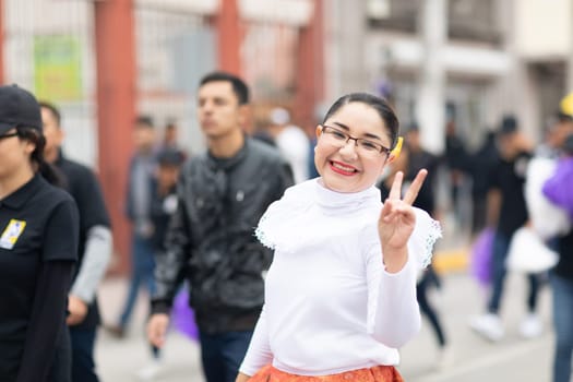Matamoros, Tamaulipas, Mexico - November 20, 2018: The November 20 Parade, Young Mexican woman wearing traditional mexican clothing going down the road during the parade