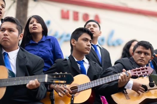 Matamoros, Tamaulipas, Mexico - November 20, 2018: The November 20 Parade, Young mexican man playing the guitar on a float