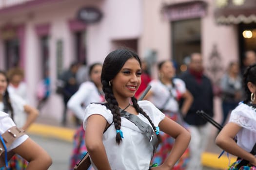 Matamoros, Tamaulipas, Mexico - November 20, 2018: The November 20 Parade, Young women wearing traditional Mexican clothing dancing