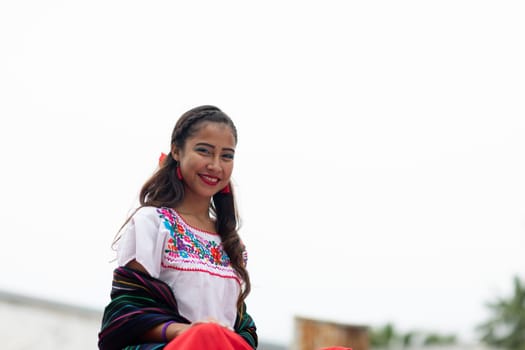 Matamoros, Tamaulipas, Mexico - November 20, 2018: The November 20 Parade, Young Mexican woman wearing traditional mexican clothing going down the road during the parade