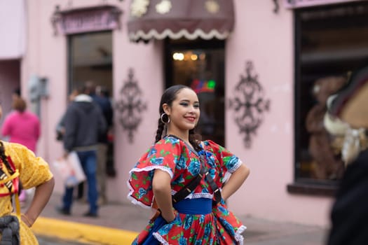 Matamoros, Tamaulipas, Mexico - November 20, 2018: The November 20 Parade, Young women wearing traditional Mexican clothing dancing