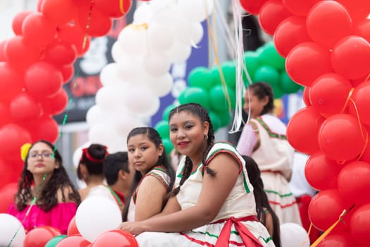 Matamoros, Tamaulipas, Mexico - November 20, 2018: The November 20 Parade, Young Mexican woman wearing traditional mexican clothing going down the road during the parade