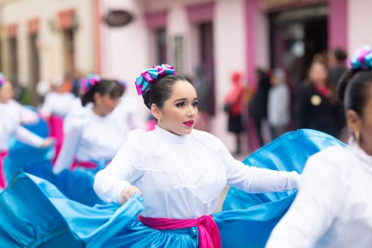 Matamoros, Tamaulipas, Mexico - November 20, 2018: The November 20 Parade, Young women wearing traditional Mexican clothing dancing