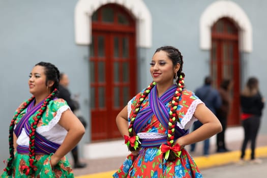 Matamoros, Tamaulipas, Mexico - November 20, 2018: The November 20 Parade, Young women wearing traditional Mexican clothing dancing