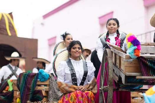 Matamoros, Tamaulipas, Mexico - November 20, 2018: The November 20 Parade, Young Mexican woman wearing traditional mexican clothing going down the road during the parade