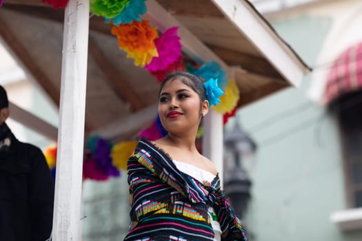 Matamoros, Tamaulipas, Mexico - November 20, 2018: The November 20 Parade, Young Mexican woman wearing traditional mexican clothing going down the road during the parade