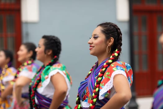 Matamoros, Tamaulipas, Mexico - November 20, 2018: The November 20 Parade, Young women wearing traditional Mexican clothing dancing