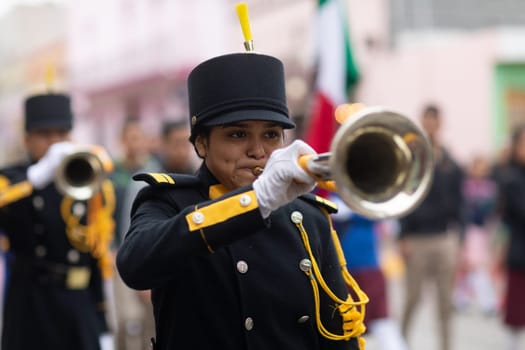 Matamoros, Tamaulipas, Mexico - November 20, 2018: The November 20 Parade, Marching Band with military Style uniform performing at the parade