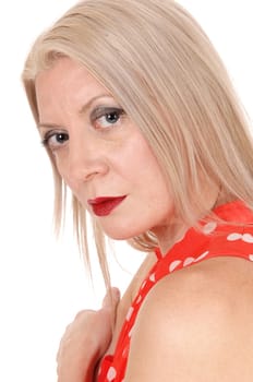 A beautiful lovely serious blond woman in a close up portrait looking.into the camera, isolated for white background.