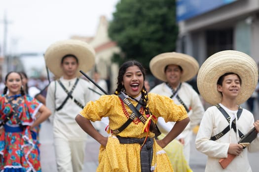 Matamoros, Tamaulipas, Mexico - November 20, 2018: The November 20 Parade, Young women wearing traditional Mexican clothing dancing