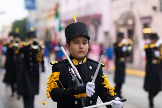 Matamoros, Tamaulipas, Mexico - November 20, 2018: The November 20 Parade, Marching Band with military Style uniform performing at the parade