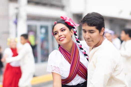 Matamoros, Tamaulipas, Mexico - November 20, 2018: The November 20 Parade, Young women and men dancing wearing traditional mexican clothing during the parade