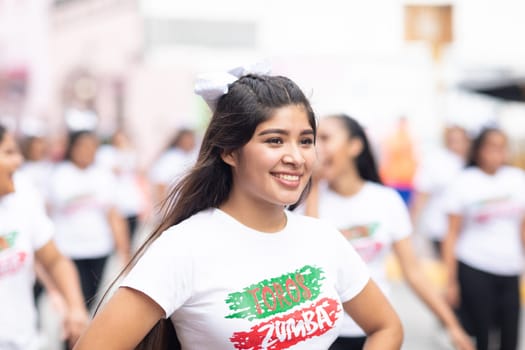 Matamoros, Tamaulipas, Mexico - November 20, 2018: The November 20 Parade, Young woman dancing zumba during the parade