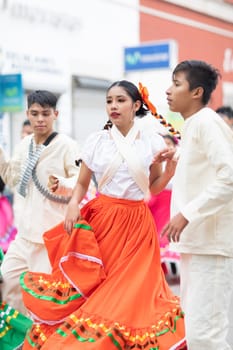 Matamoros, Tamaulipas, Mexico - November 20, 2018: The November 20 Parade, Young women and men dancing wearing traditional mexican clothing during the parade