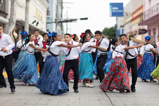 Matamoros, Tamaulipas, Mexico - November 20, 2018: The November 20 Parade, Young women and men dancing wearing traditional mexican clothing during the parade