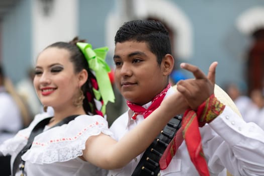 Matamoros, Tamaulipas, Mexico - November 20, 2018: The November 20 Parade, Young women and men dancing wearing traditional mexican clothing during the parade