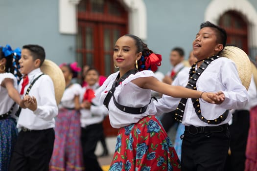 Matamoros, Tamaulipas, Mexico - November 20, 2018: The November 20 Parade, Young women and men dancing wearing traditional mexican clothing during the parade