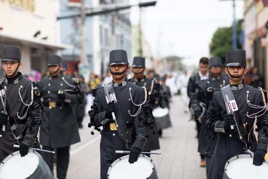 Matamoros, Tamaulipas, Mexico - November 20, 2018: The November 20 Parade, Marching Band with military Style uniform performing at the parade