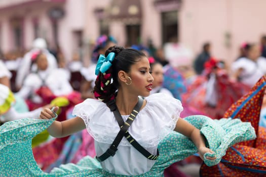 Matamoros, Tamaulipas, Mexico - November 20, 2018: The November 20 Parade, Young women wearing traditional Mexican clothing dancing