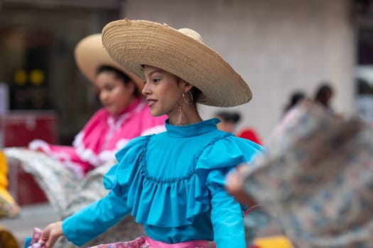Matamoros, Tamaulipas, Mexico - November 20, 2018: The November 20 Parade, Young women wearing traditional Mexican clothing dancing
