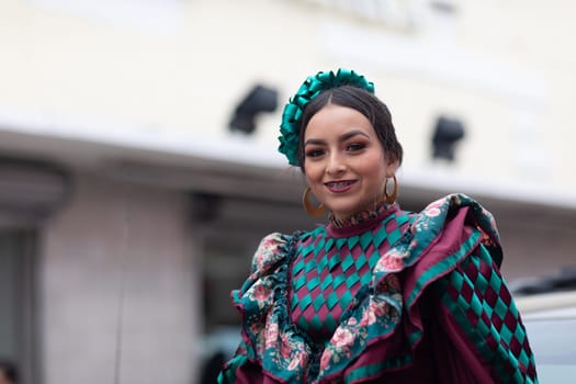 Matamoros, Tamaulipas, Mexico - November 20, 2018: The November 20 Parade, Young Mexican woman wearing traditional mexican clothing going down the road during the parade