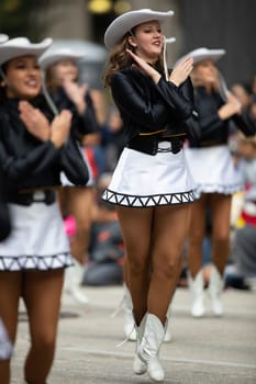 Houston, Texas, USA - November 22, 2018 The H-E-B Thanksgiving Day Parade, The Apache Belles from Tyler Junior College, from Tyler, Texas, Dancing wearing a cowgirl outfit