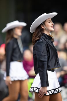 Houston, Texas, USA - November 22, 2018 The H-E-B Thanksgiving Day Parade, The Apache Belles from Tyler Junior College, from Tyler, Texas, Dancing wearing a cowgirl outfit