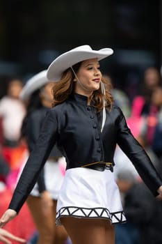 Houston, Texas, USA - November 22, 2018 The H-E-B Thanksgiving Day Parade, The Apache Belles from Tyler Junior College, from Tyler, Texas, Dancing wearing a cowgirl outfit