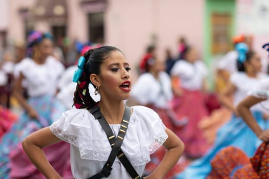 Matamoros, Tamaulipas, Mexico - November 20, 2018: The November 20 Parade, Young women wearing traditional Mexican clothing dancing