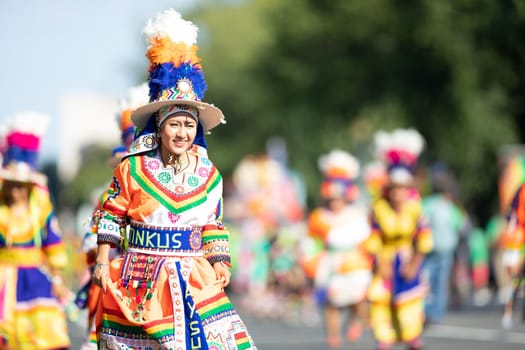 Washington, D.C., USA - September 29, 2018: The Fiesta DC Parade, Bolivian women wearing traditional clothing performing a traditional dance from bolivia